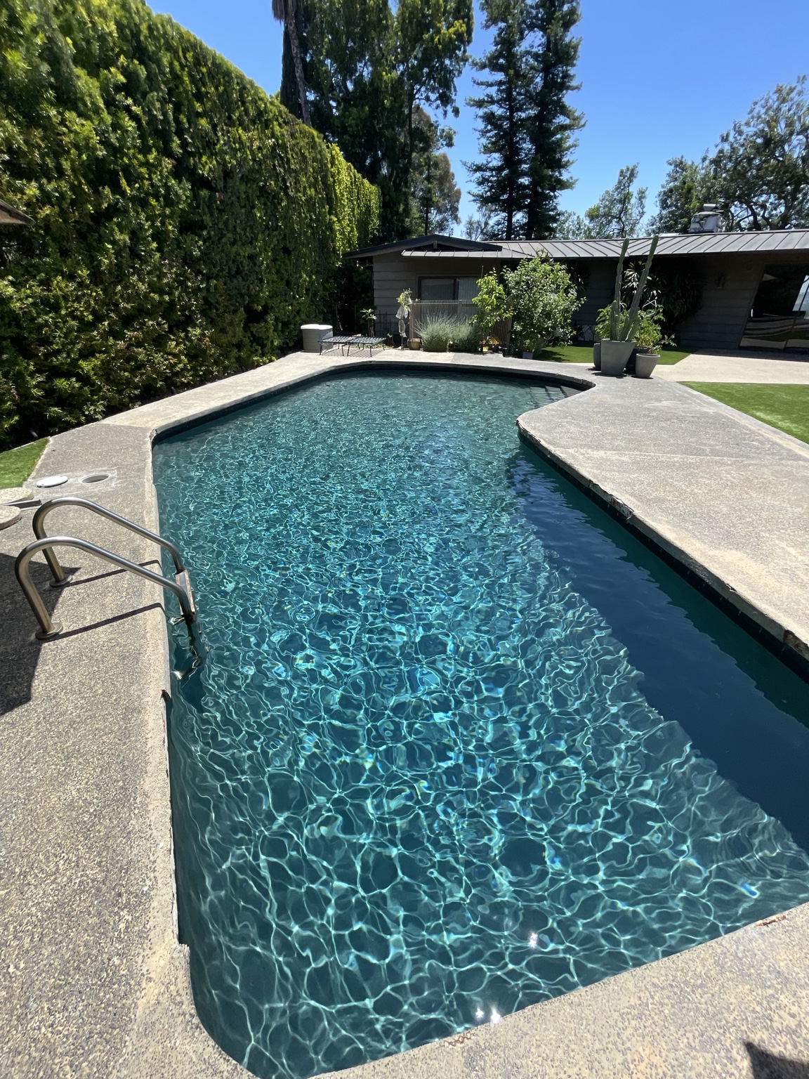 Clear blue pool photo in an illustrative service-update mockup